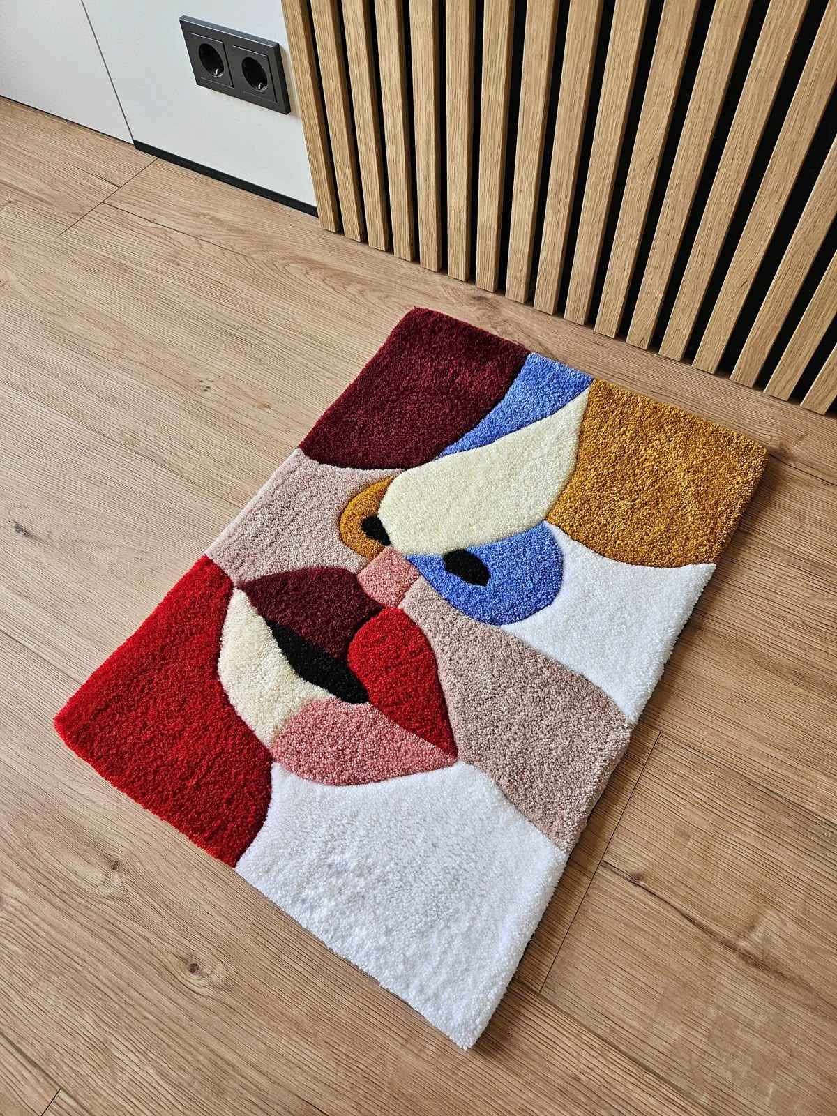Abstract area rug with multicolor geometric shapes on light background