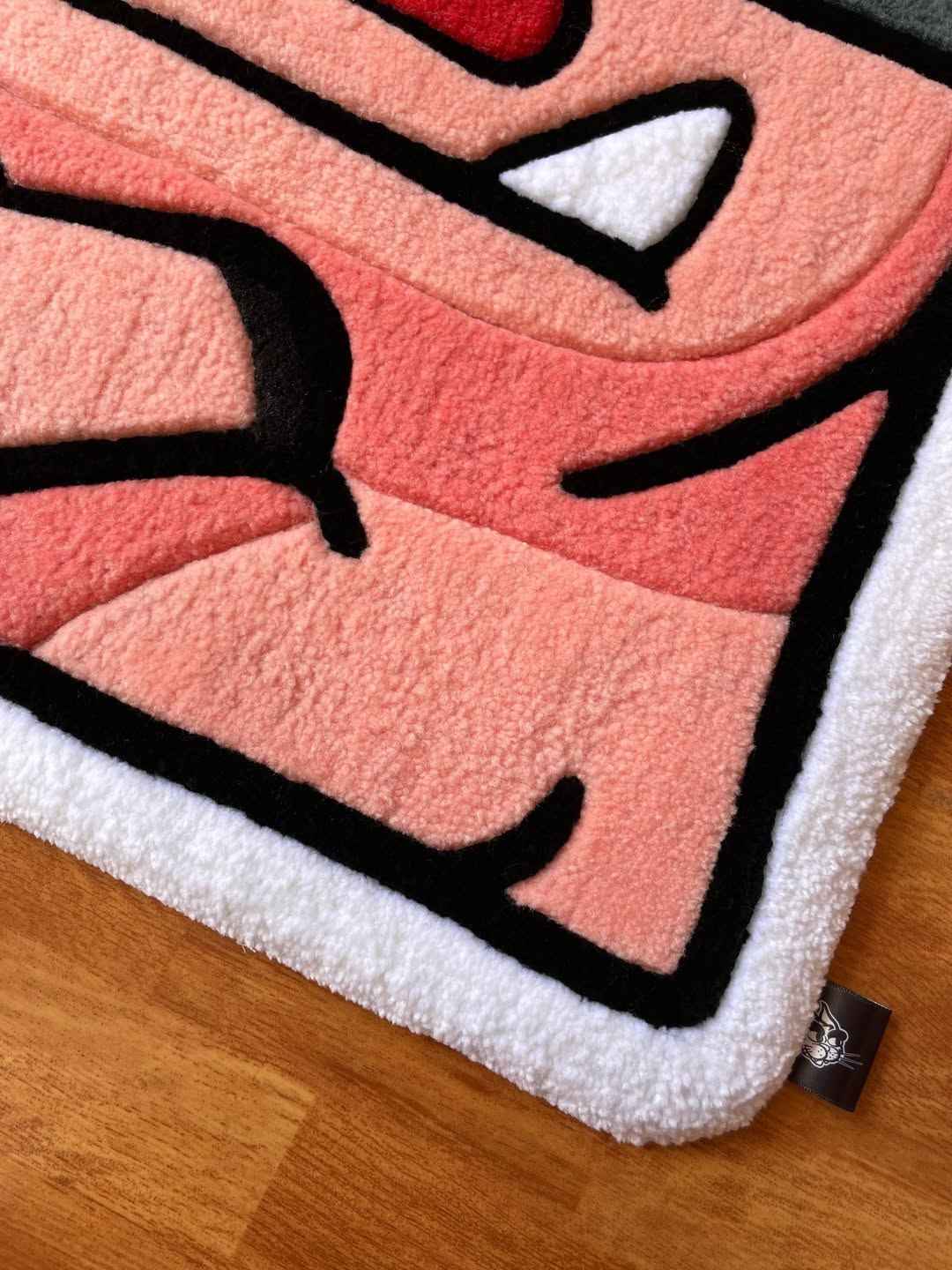 Royal Hog Rug close-up of pink tufted texture with white-edged border