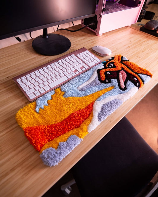 Colorful shaggy keyboard rug with orange, red, and gray game character graphic