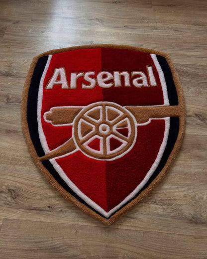 Arsenal shield football rug with red, black, and white crest and gold border